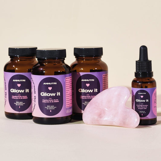 Supplement bottles labeled 'Glow it' with a pink crystal on a beige background