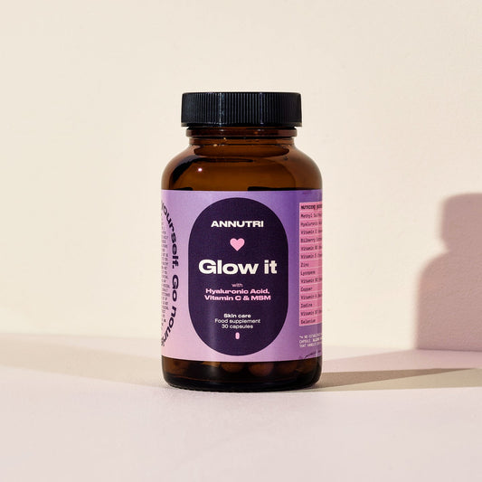 Vitamin supplement bottle labeled 'Glow it' by Annutri on a light background