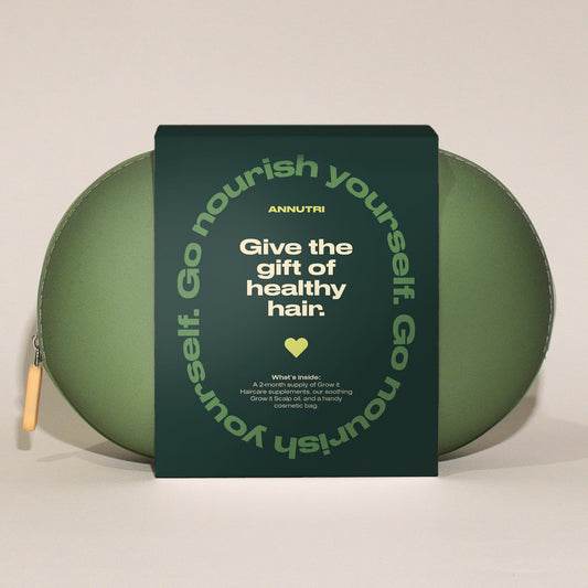 Green hair care product with a label on a beige background