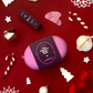 Gift set flatlay with christmas baubles one red background